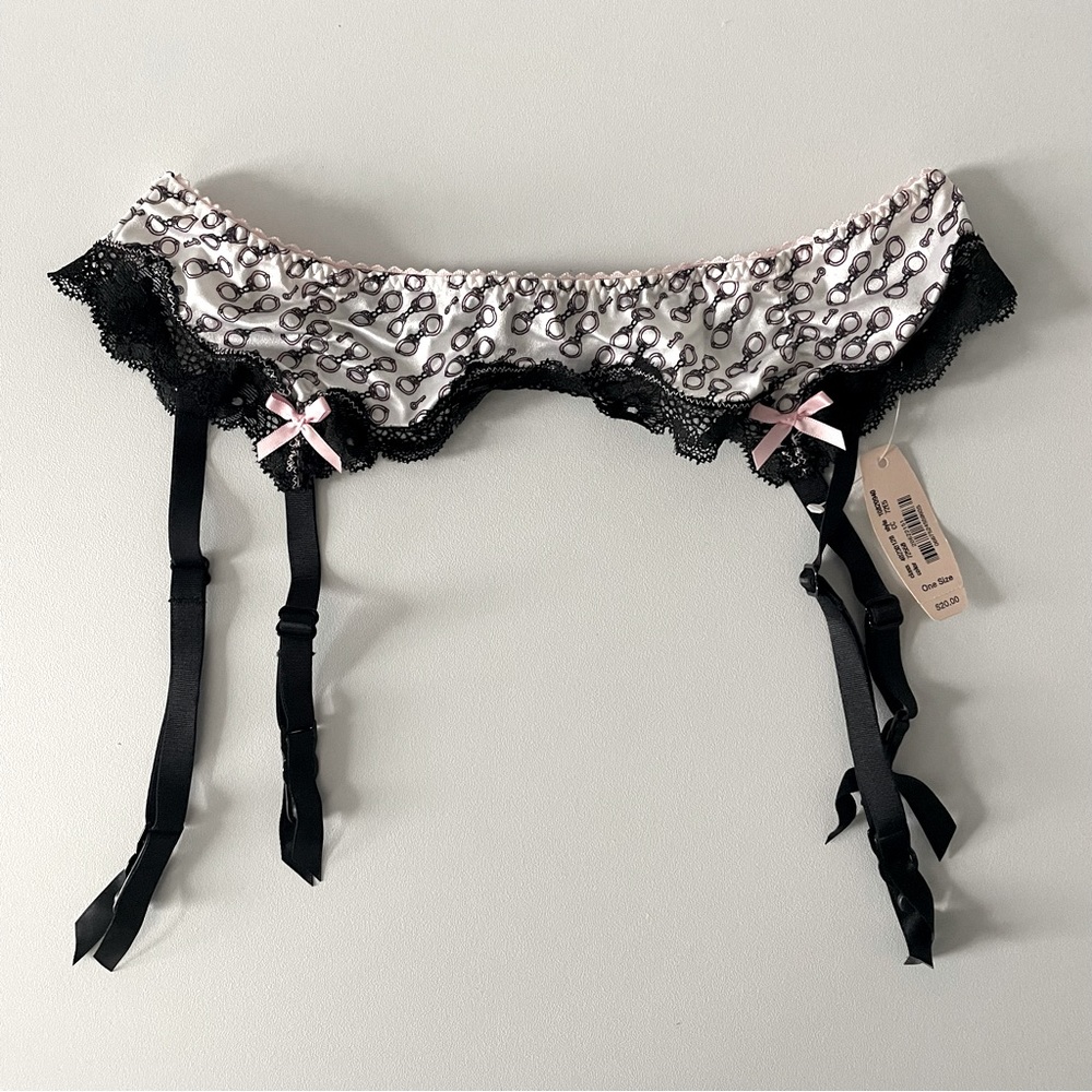 Victoria’s Secret Garter Belt with handcuff design NWT. One Size.